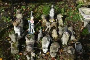 A LARGE SELECTION OF WEATHERED COMPOSITE ANIMAL GARDEN FIGURES, of dogs, cats, puppy's, birds,