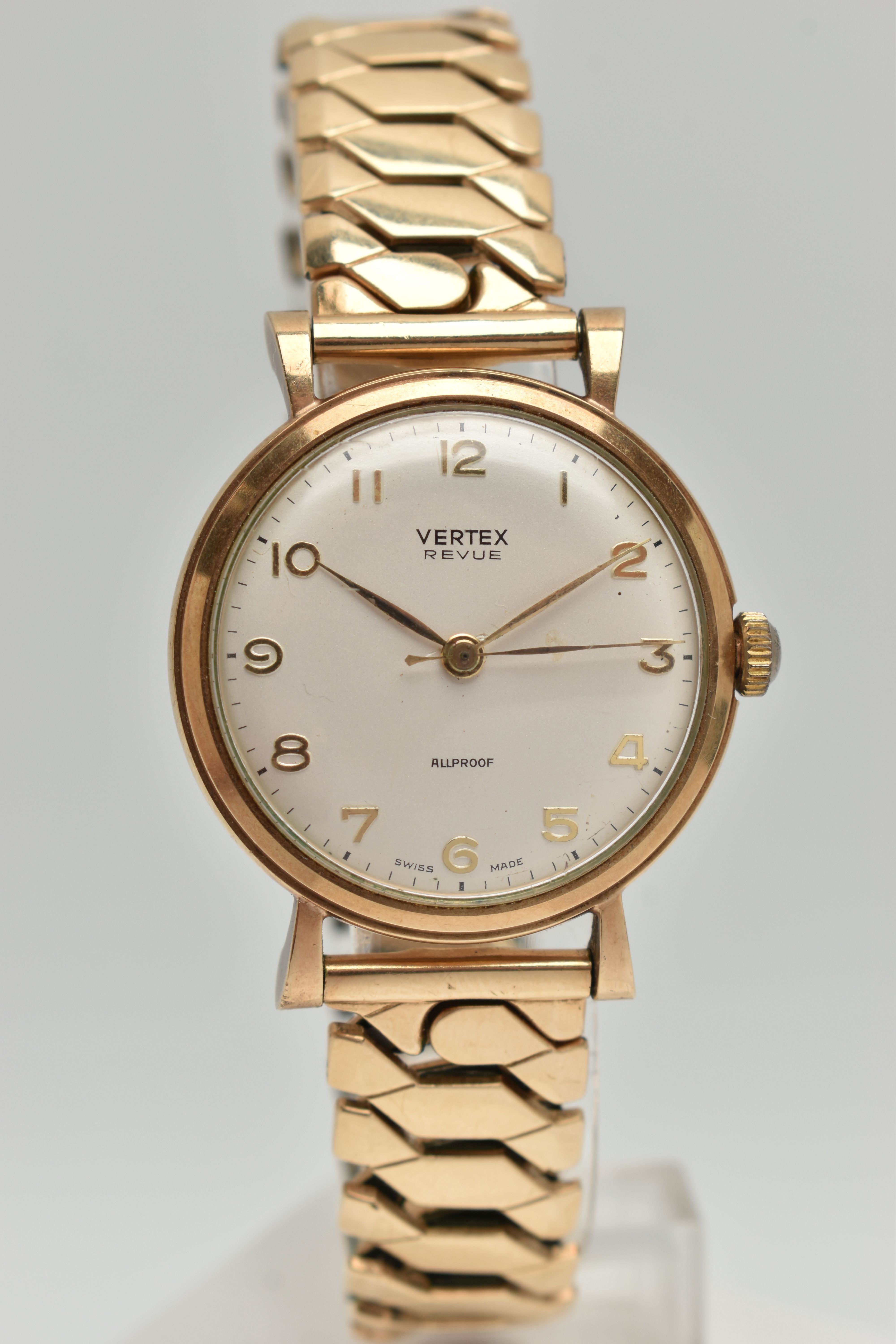 A 9CT GOLD WRISTWATCH, hand wound movement, round dial signed 'Vertex Revue' Arabic numerals, yellow