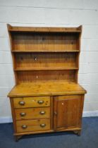 A 19TH CENTURY AND LATER PINE DRESSER, the later top with a three tier plate rack and sixteen hooks,