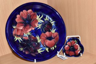 A MOORCROFT POTTERY SHALLOW BOWL AND PIN DISH, both in the Anemone pattern, tube lined with red