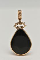 A 9CT GOLD PENDANT, pear shape drop pendant, set with onyx and sodalite inlays, in a collet mount,