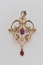 AN EARLY 20TH CENTURY OPENWORK GARNET AND SPLIT PEARL PENDANT, of scrolling organic leaf design, set