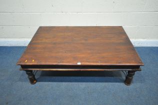 A RECTANGULAR HARDWOOD COFFEE TABLE, with metal studs and mounts, length 136cm x depth 91cm x height