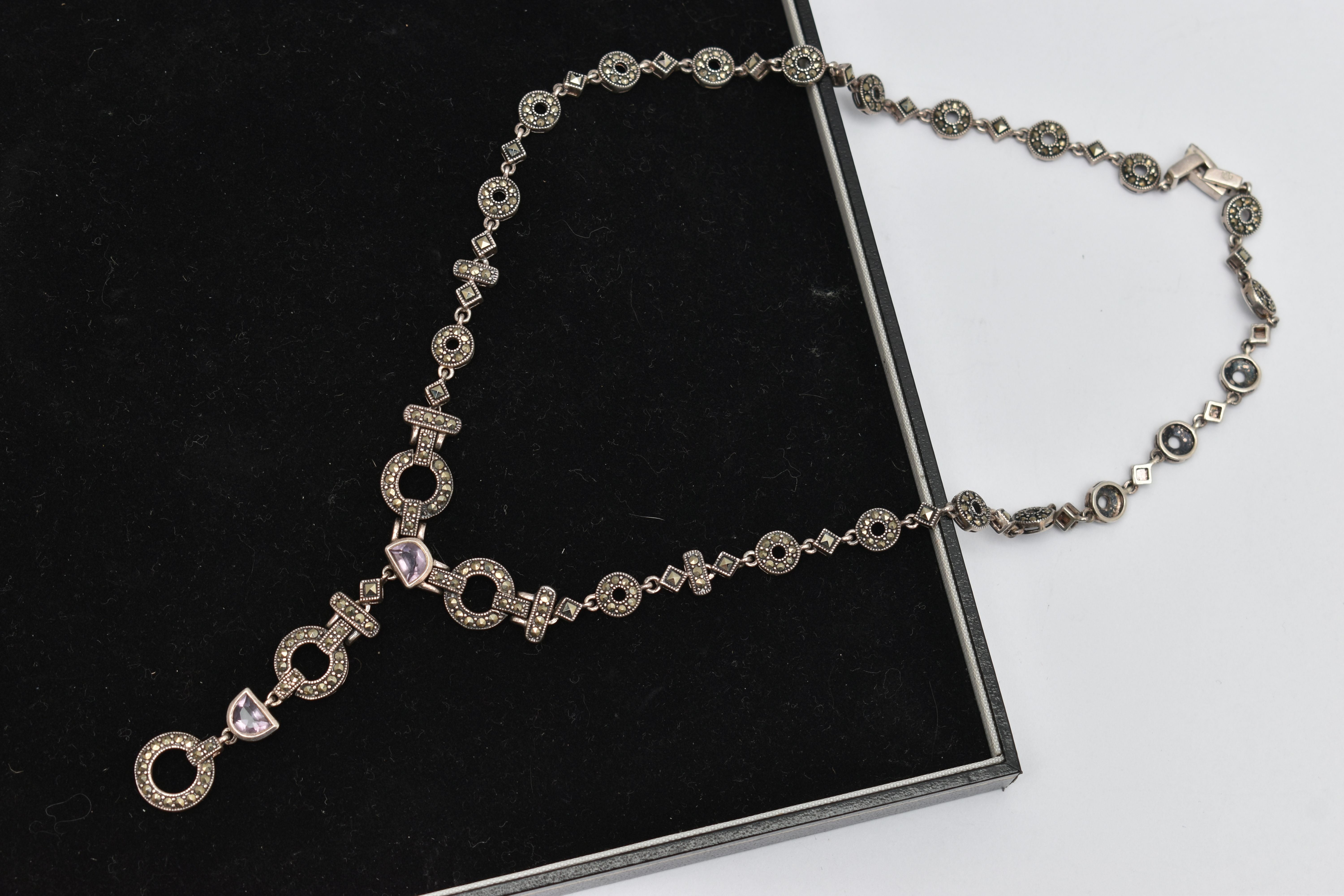 A MARCASITE AND AMETHYST NECKLACE, designed as circular, square and rectangular links joining at a