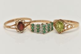 THREE GEM SET RINGS, to include an emerald and diamond cluster ring, rubbed 9ct hallmark, ring