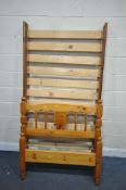 A MODERN PINE SINGLE BEDSTEAD, with side rails, slats and bolts (condition report: one slat snapped,