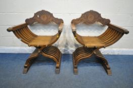 A PAIR OF 20TH CENTURY OAK SAVONAROLA CHAIRS, the detachable back rest with foliate carving, with
