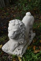 A PAINTED COMPOSITE GARDEN LION, with its prey, length 56cm x depth 27cm x height 34cm (condition