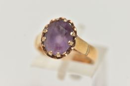 A 22CT GOLD GEM SET RING, oval cut amethyst, prong set in yellow gold, hallmarked 22ct Birmingham,