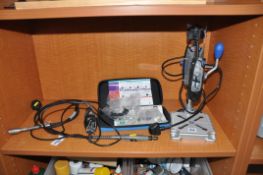 A DREMMEL MODEL 3000 ROTARY TOOLS on a Work Station 200, a Model 300 rotary tool with a flexi shaft,