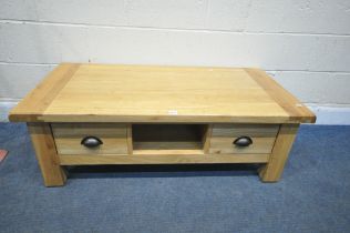 A MODERN SOLID LIGHT OAK COFFEE TABLE, with two drawers, length 121cm x depth 60cm x height 41cm (