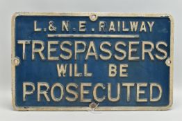 A CAST IRON RAILWAY SIGN, reading 'L. & N. E. Railway, Trespassers will be Prosecuted', painted in