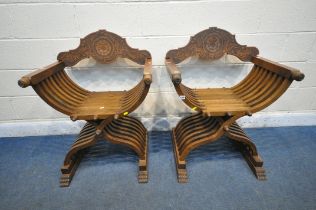 A PAIR OF 20TH CENTURY OAK SAVONAROLA CHAIRS, the detachable back rest with foliate carving, with
