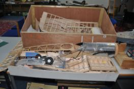 A FLAIR BRISTOL F2b FIGHTER MODEL PLANE partially built with parts in a plywood box and plans
