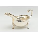 AN ELIZABETH II SILVER SAUCE BOAT, a scalloped edge sauce boat with three hooved feet, hallmarked 'T