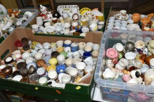 EIGHT BOXES CONTAINING A LARGE COLLECTION OF CERAMIC EGG CUPS, to include over three hundred