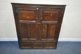 A 16TH/17TH CENTURY AND LATER WELSH OAK CUPBOARD, fitted with two fielded panelled doors,