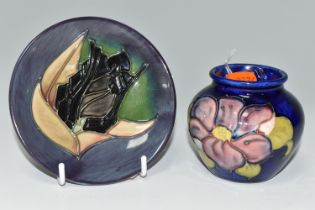 TWO PIECES OF MOORCROFT POTTERY, comprising a pin dish in 'Black Tulip' pattern on a grey-purple and
