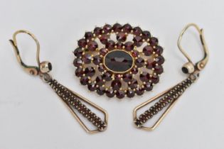 A BOHEMIAN GARNET BROOCH AND A PAIR OF GARNET DROP EARRINGS, oval open work brooch set with a