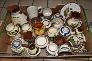 A BOX OF DEVON MOTTO WARE, approximately thirty five pieces by various potteries including Watcombe,