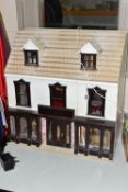 A MODERN KIT BUILT WOODEN DOLLS HOUSE, modelled as a Victorian/Edwardian ground floor shop with