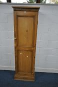 A MODERN PINE CUPBOARD, with a single panelled door, width 56cm depth 36cm x height 186cm (condition