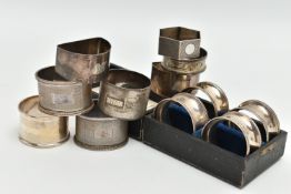 AN ASSORTMENT OF SILVER NAPKIN RINGS, to include a cased set of four napkin rings with bead