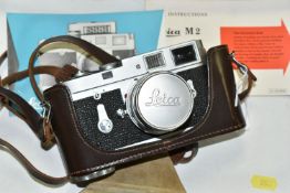 A LEICA M2 RANGEFINDER CAMERA, serial number M2-1006 225, fitted with a Leitz Summicron 50mm f2