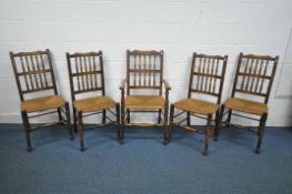 A SET OF FIVE 20TH CENTURY OAK RUSH SEATED LANCASHIRE CHAIRS, including one carver (condition