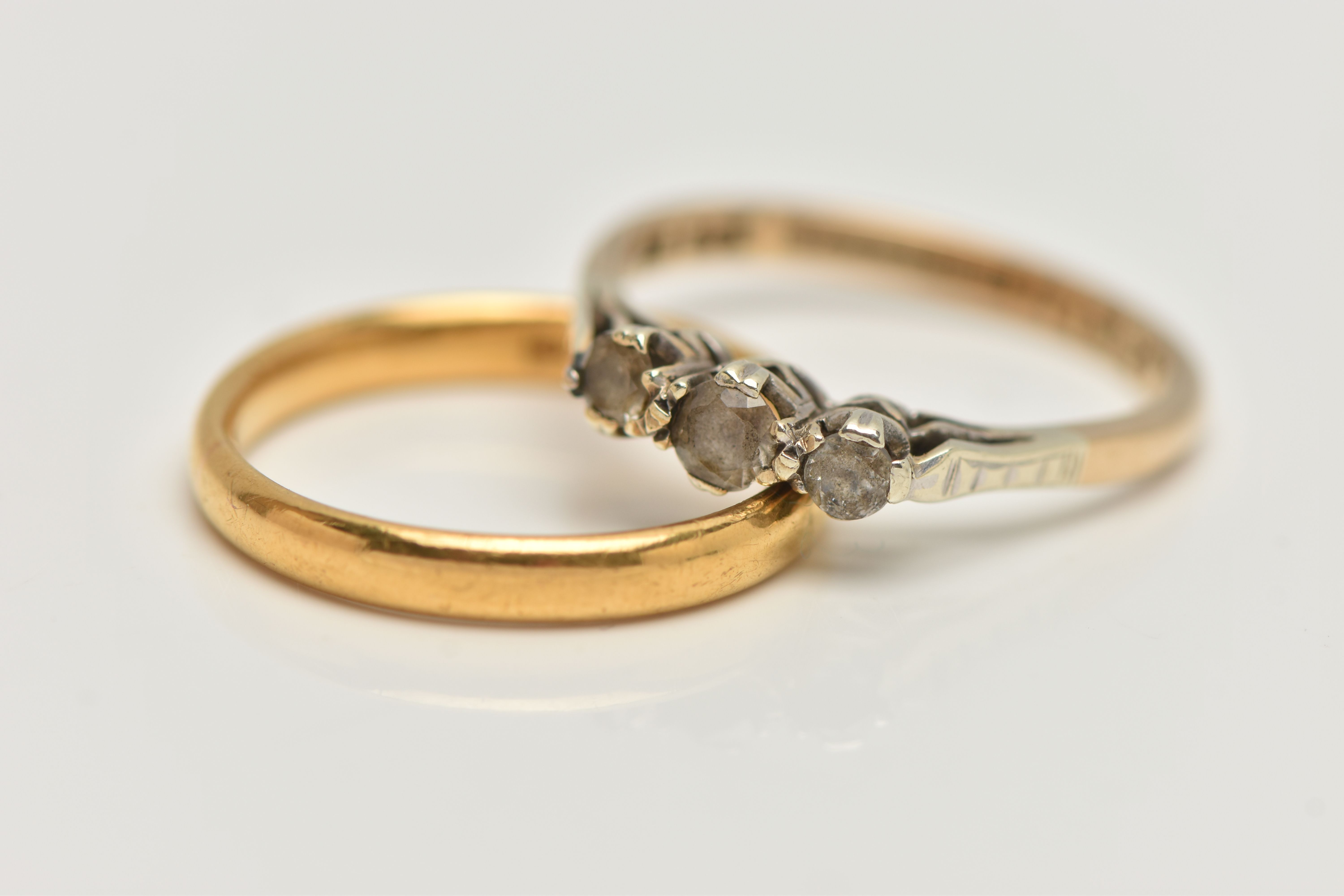 TWO RINGS, to include a synthetic white sapphire three stone ring, stamped HS 9ct syn.w.sapph HI994,