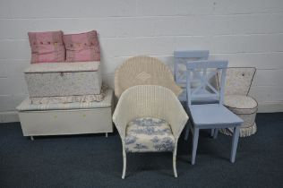A WHITE PAINTED WICKER OTTOMAN, a fabric ottoman and chair, two pink cushions, two wicker chairs,