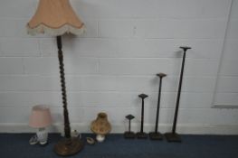 A SET OF FOUR 20TH CENTURY OAK GRADUATED STANDS, with tapered shaft, tallest 123cm x shortest