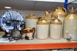 A GROUP OF SIX STONEWARE ALE AND CIDER FLAGONS, comprising a large flagon printed and impressed