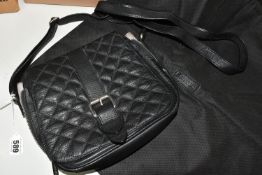 A BLACK LEATHER BARBOUR INTERNATIONAL SHOULDER BAG, with original dust bag, a medium sized quilted