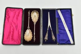 CASED SILVER SPOONS AND GLOVE STRETCHERS, the pair of cased late Victorian silver spoons have