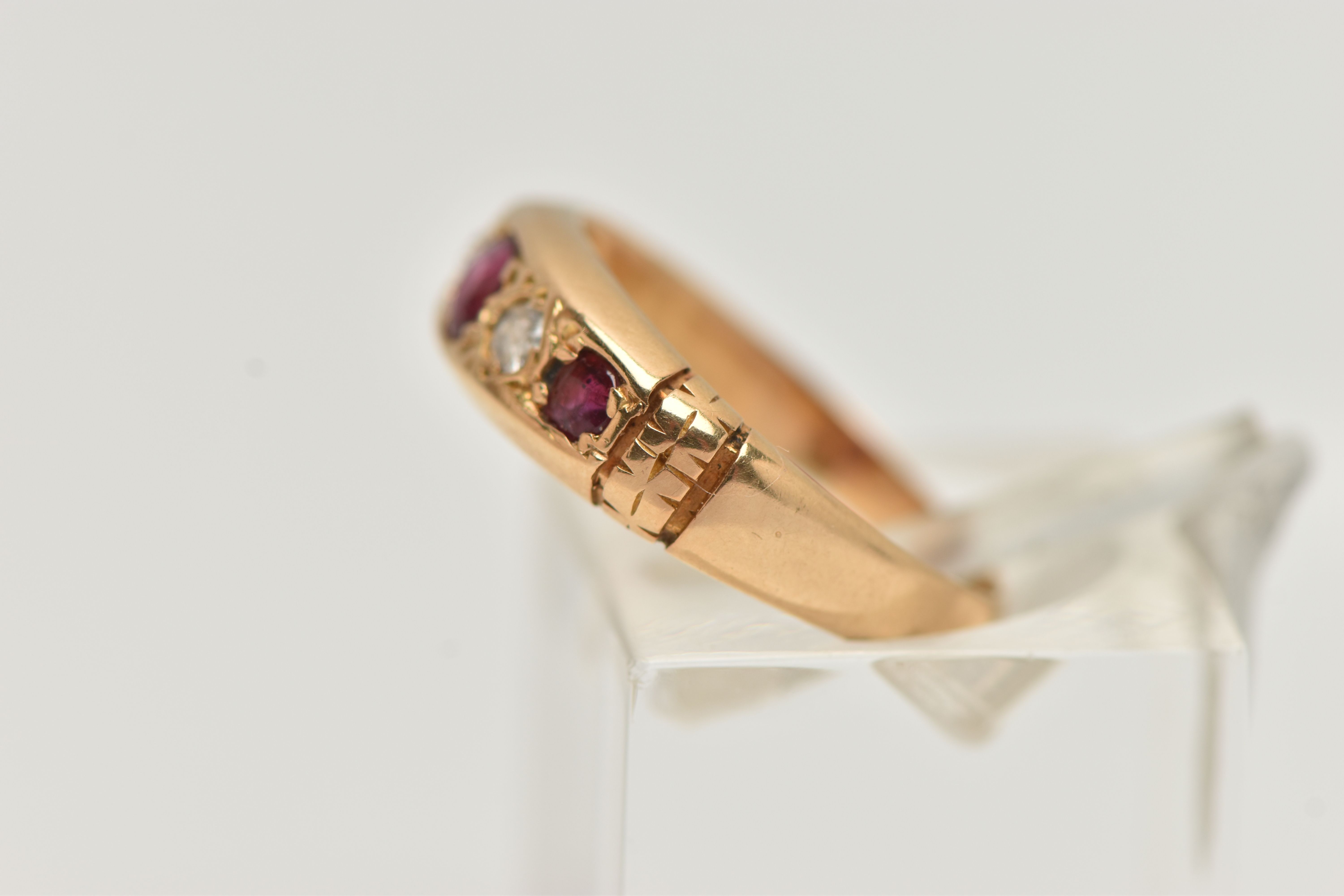AN EARLY 20TH CENTURY, 18CT GOLD RUBY AND DIAMOND FIVE STONE RING, set with three circular cut - Image 2 of 4