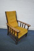 A 20TH CENTURY OAK RECLINING ARMCHAIR, with mustard buttoned upholstery, width 71cm x depth 81cm x