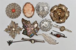 ELEVEN BROOCHES AND A STICKPIN, to include a late Victorian silver circular brooch with butterfly