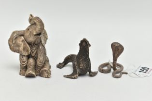 THREE ANIMAL ORNAMENTS, the first a filled silver seated elephant, with silver hallmark, the