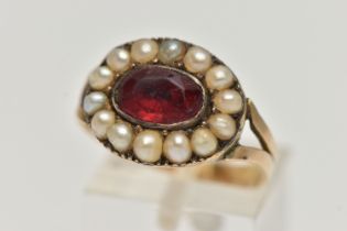 A LATE VICTORIAN PASTE AND SPLIT PEARL RING, designed as a central oval red paste within a split