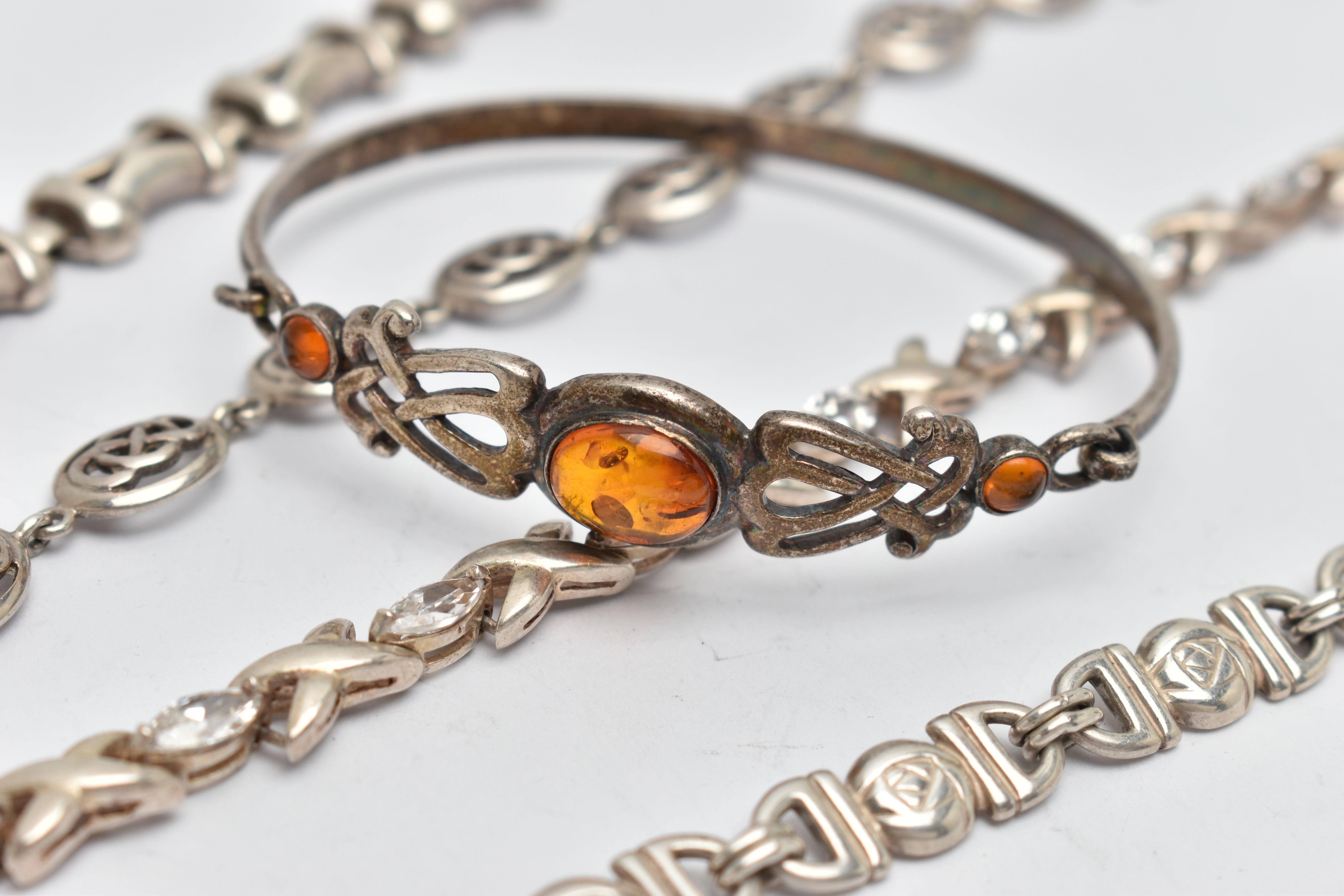 FIVE BRACELETS, to include a white metal hinged bangle set with amber cabochons, stamped 925, a - Image 2 of 4