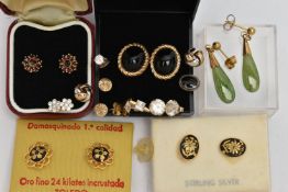 A BAG OF ASSORTED EARRINGS, to include a pair of yellow metal garnet cluster stud earrings, post and