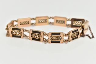 AN EARLY 20TH CENTURY YELLOW METAL ELEPHANT HAIR BRACELET, comprised of nine rectangular form panels