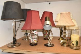 A GROUP OF TABLE LAMPS, to include two ceramic bodied table lamps painted with flowers, a pair of