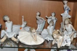 NINE NAO FIGURES OF BALLERINAS, in different poses, tallest standing ballerina holding shoes 29cm,