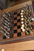 A CHESS SET AND BOARD, (possibly Italfarma Persan) silver and gold weighted metal pieces, chess