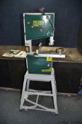 A RECORD BS250 BANDSAW ON WHEELED STAND with parallel and mitre guides, manual and spare blades,