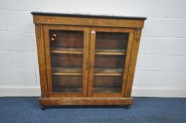 A 19TH CENTURY WALNUT AND INLAID PIER CABINET, brass mounts and beading, the two glazed doors