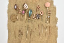 A SELECTION OF STICK PINS, thirteen in total to include a gold plated mourning pin, black enamel