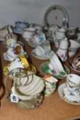 A GROUP OF TEA WARES, to include a Belleek sugar bowl or preserve dish on a plated stand, teacups
